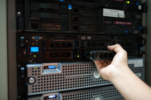 Man fix server network in data center room .