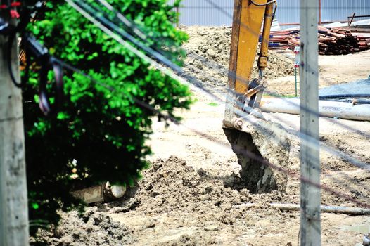 An excavator on a construction site .