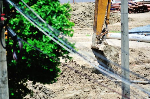 An excavator on a construction site .