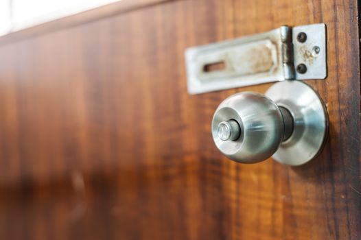 An Steel knob in soft light .