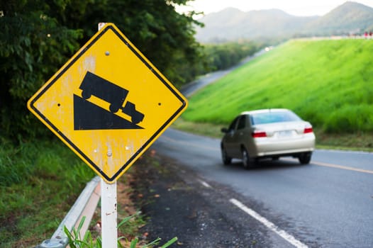 An Steep sign symbol warning dangerous .