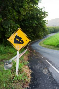 An Steep sign symbol warning dangerous .