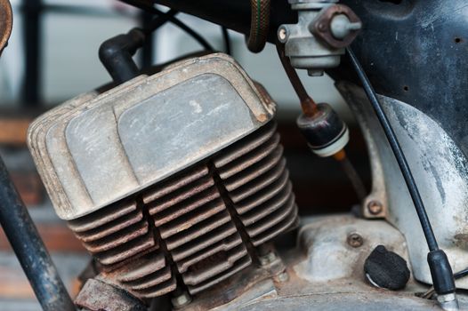 An Old vintage motocycle in retro place .