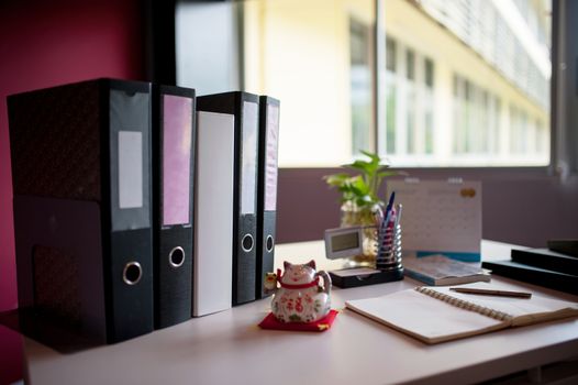 Office desk in work place with soft light .