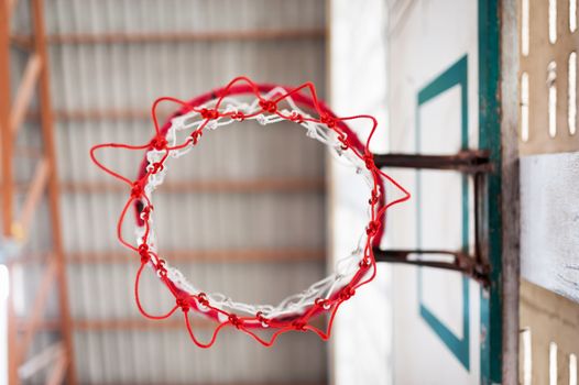 An Basketball hoop indoor sport .