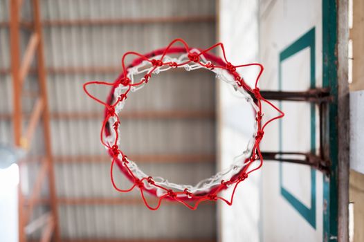 An Basketball hoop indoor sport .