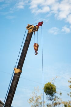 An Crane in construction with blue sky .