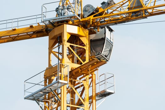 An Crane in construction with blue sky .