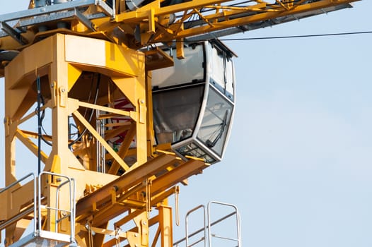 An Crane in construction with blue sky .