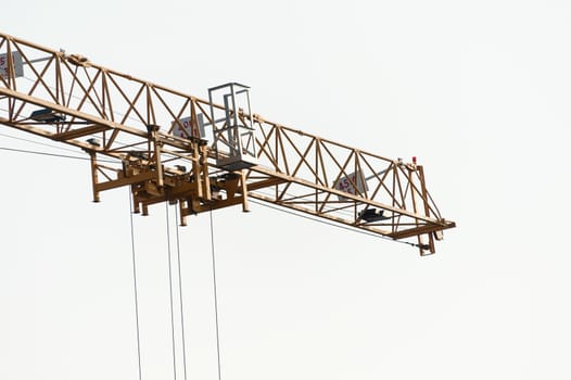 An Crane in construction with blue sky .