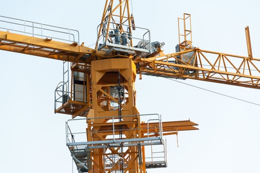 An Crane in construction with blue sky .