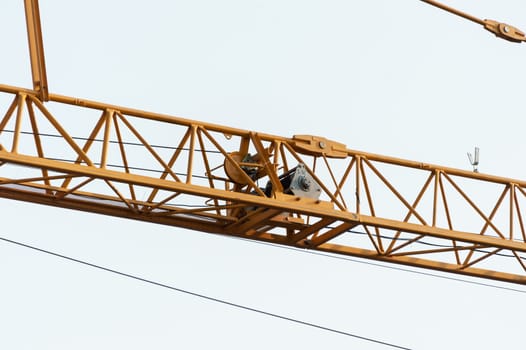 An Crane in construction with blue sky .