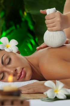 portrait of young beautiful woman in spa environment