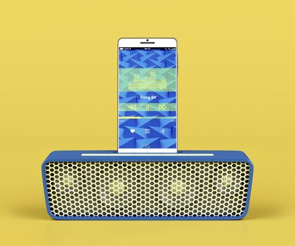 Front view of docking station speaker and smartphone on yellow background