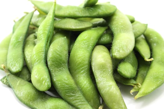 Fresh green soybeans on white background