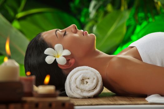 portrait of young beautiful woman in spa environment