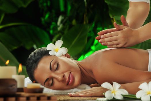 portrait of young beautiful woman in spa environment.