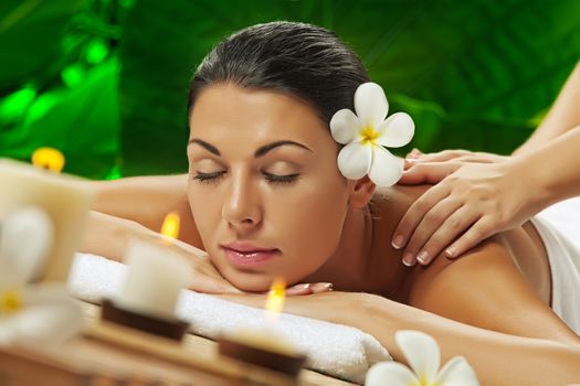 portrait of young beautiful woman in spa environment.