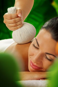 portrait of young beautiful woman in spa environment