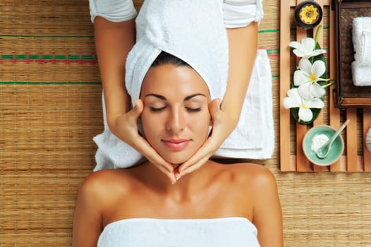 portrait of young beautiful woman in spa environment