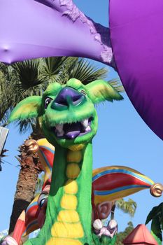 Nice, France - February 21 2016: The Jester and the Green Dragon. Parade Float during the Carnival of Nice (Corso Carnavalesque 2016) in French Riviera. The Theme for 2016 was King of Media