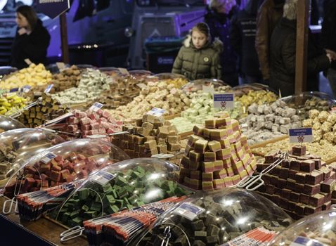 HOEK VAN HOLLAND,NETHERLANDS - FEBRUARI 20: Unidentified girl looking at lots of candys at the food market  Februari 20 2016 in Almelo,the food market is in the old monuments of the famous dutch textile industry 