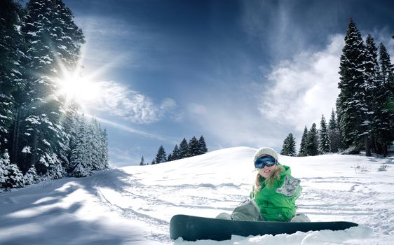 view of a young girl snowboarding in winter environment