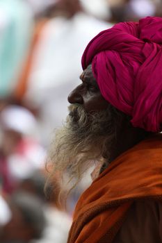 Pune, India - July 11, 2015: A portrait of an old Indian pilgrim during the Wari pilgrimmage/festival, in Pune, India.