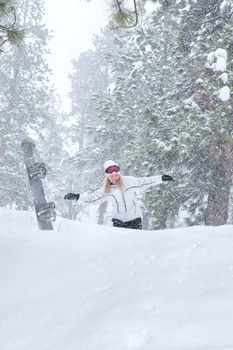 Portrait of young beautiful woman on winter outdoor background