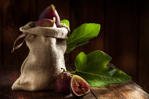 close up view of fresh figs on color back