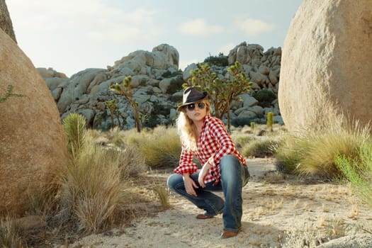 portrait of young beautiful girl in Joshua Tree park environment