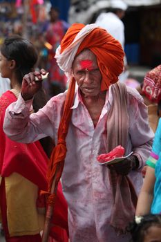 Pune, India  - ‎July 11, ‎2015: An old Indian pilgrim in a traditional attire during a religious wari pilgrimmage festival in India