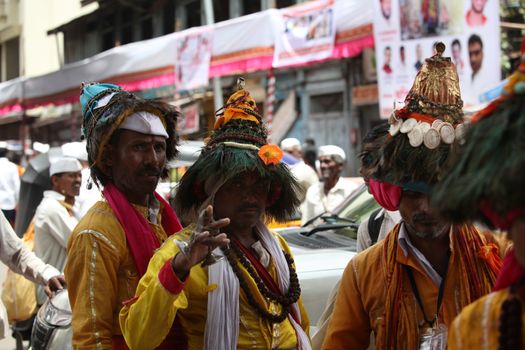 Pune, India  - ‎July 11, ‎2015: A group of traditional Vasudevs gathered together during the Waari festival in India.