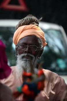 Pune, India  - ‎July 11, ‎2015: An old Indian pilgrim in a traditional attire during a religious wari pilgrimmage festival in India