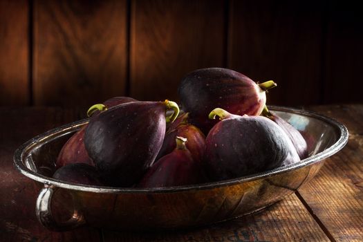 close up view of fresh figs on color back