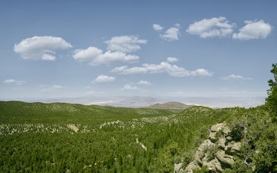 panoramic view of nice green hill on blue sky background