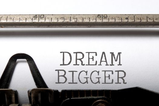 Dream bigger printed on an old typewriter 