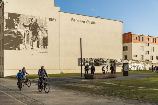 BERLIN - APRIL 3: The Berlin Wall Memorial in Bernauer strasse. This is the intersection with Acker strasse and the photos depict the place over the years on April 3, 2015 in Berlin, Germany.