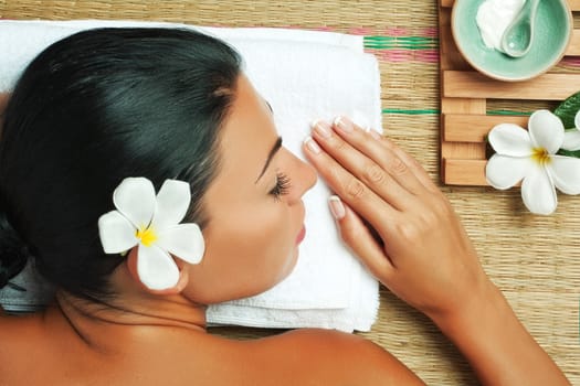 portrait of young beautiful woman in spa environment.