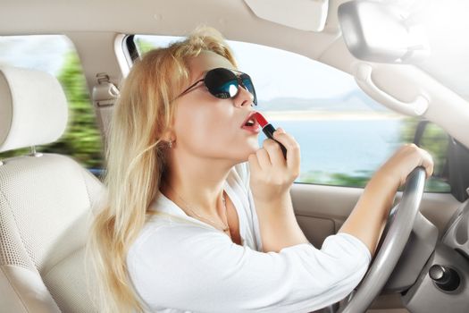 portrait of young beautiful woman sitting in the car