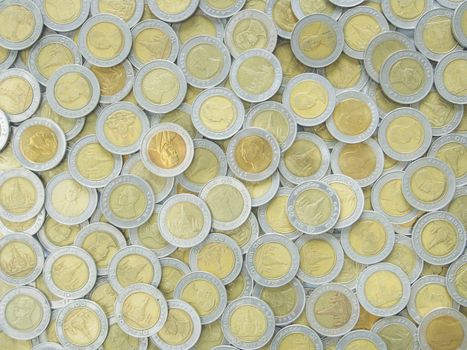 Silver metal coins used to cover the background.