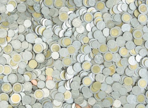 Silver metal coins used to cover the background.