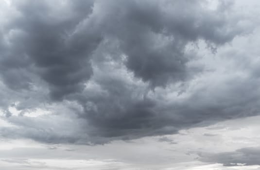 Abstract background of blue sky with white clouds and rain clouds.