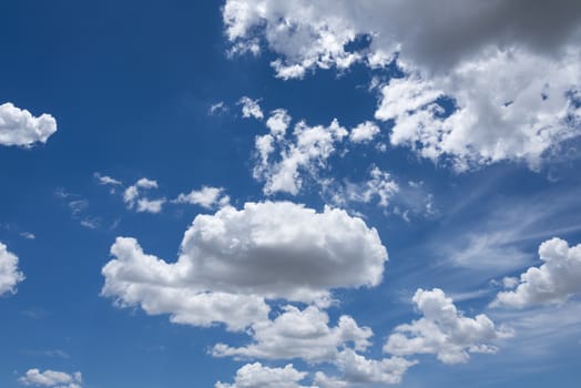 Abstract background of blue sky with white clouds and rain clouds.
