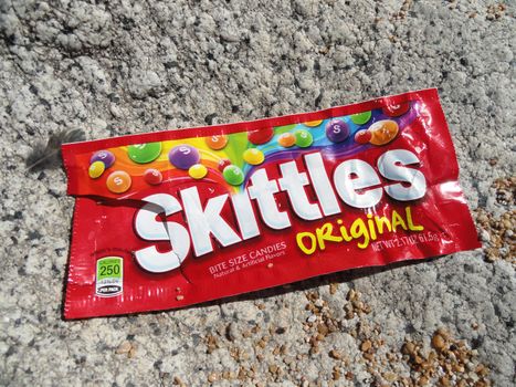 Lake Tahoe, USA - July 21 2010: Closeup of Skittles Candy on the floor, made by the Wrigley Company, a division of Mars, Inc