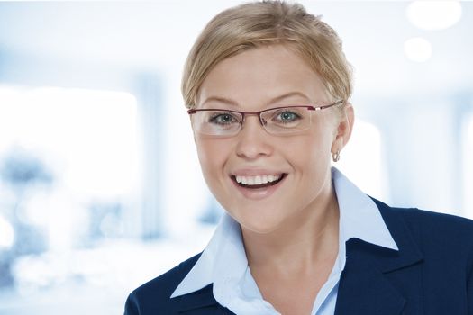 Portrait of young beautiful woman in office environment