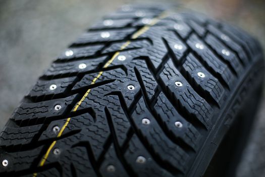 Studded tire on a background