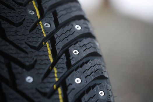 Studded tire on a background