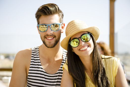 Fiends having a great time together at the beach bar