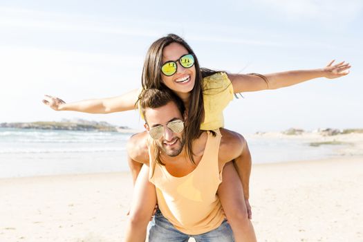 Young couple having fun at the beach